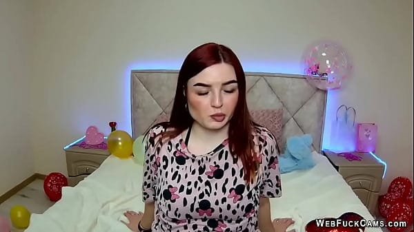 Redhead amateur babe strips pajamas and shows tattoos on webcam